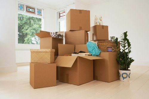 Professional movers organizing belongings in a Stockwell home