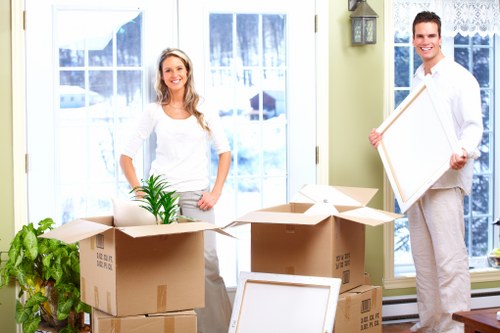 Volunteers sorting donated furniture and textiles at a community reuse centre